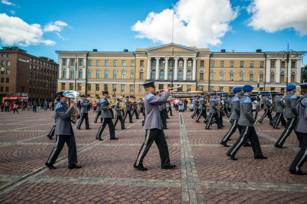 Group of Royal Guards outside the Stockholm Palace performing a guard rotation, on a sunny day in Stockholm, Sweden