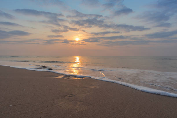 Beautiful sunset at cabo ledo beach Angola. With waves. Dramatic sky.