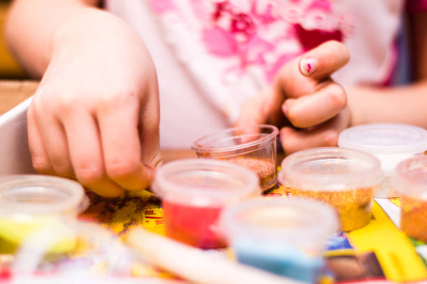 istock Young girl playing and making handmade art 826486744