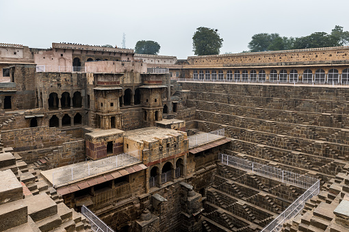 Part of the Chand Baori, a stepwell in the village of Abhaneri near Jaipur, state of Rajasthan. Chand Baori was built by King Chanda of the Nikumbha Dynasty