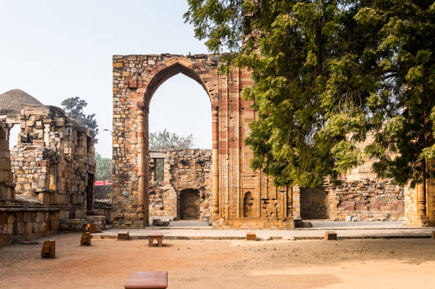 istock Qutb Mosque Arch Ruin at the Qutb complex (Qutub),  an array of monuments and buildings at Mehrauli in Delhi, India. UNESCO World Heritage Site 826497780