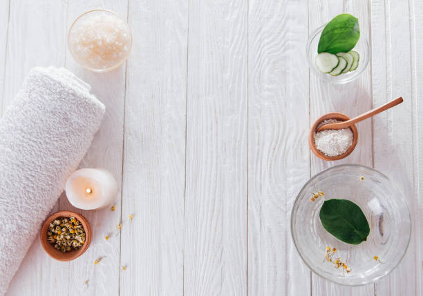 istock Spa essentials including candle, salt, herbs and white clay 826497924
