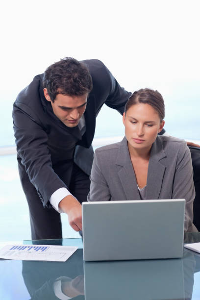 istock Portrait of a business team working with a notebook 826500536