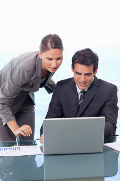 istock Portrait of a young business team working with a notebook 826500674