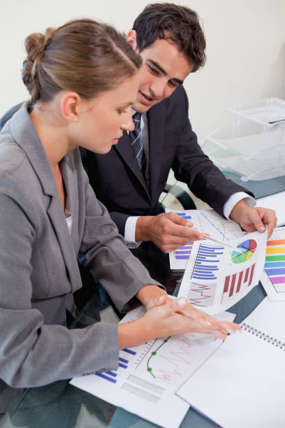 istock Portrait of a young business team studying statistics 826501612