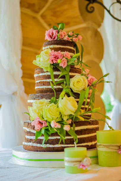 istock Elegant wedding cake with yellow flowers 826505004