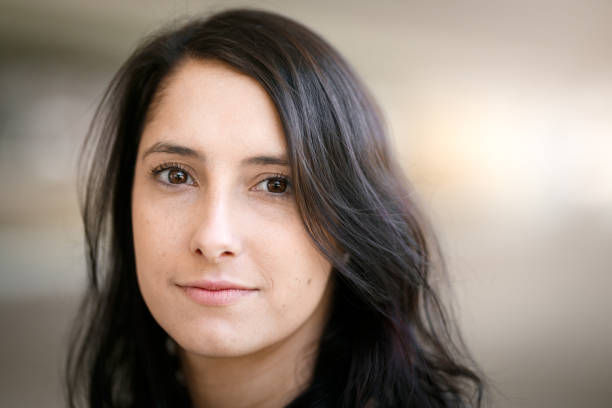istock Smiling woman portrait with blurred background 826508644