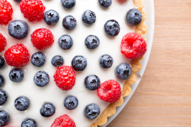 istock Cake with blueberries and raspberries. Confectionery product. 826511382
