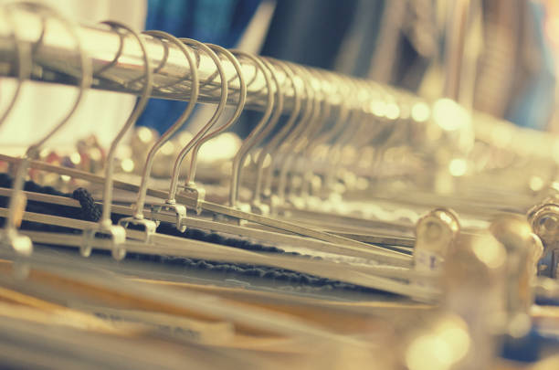 istock Many hangers in a row for clothes in the store. 826511588
