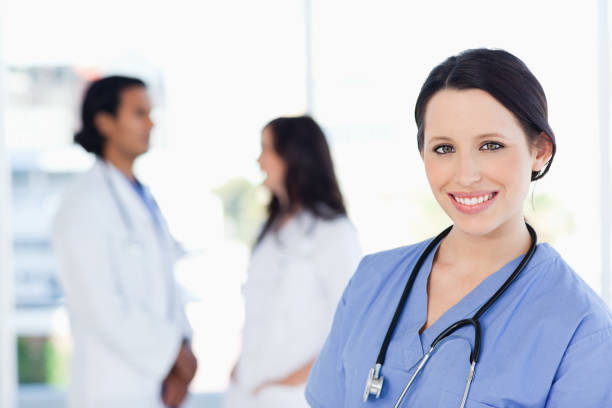 istock Young medical intern looking at the camera with a beaming smile 826515506