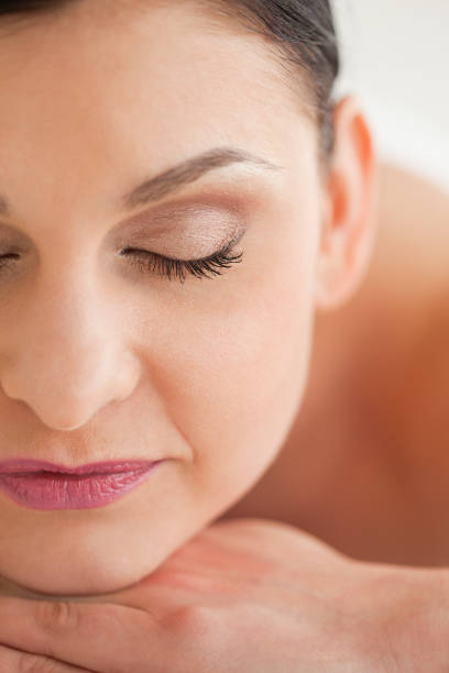 istock Attractive brunette enjoying a massage 826520100