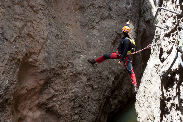 istock mountaineer pointing at something in a via ferrata 826520858