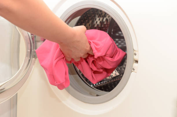 istock Washing dirty clothes in an automatic washing machine. 826523758