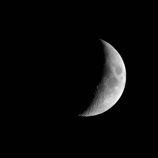 istock Waxing crescent moon seen with telescope 826524218