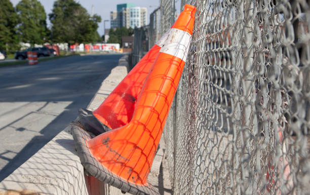 istock orange cones against a fence 826527620