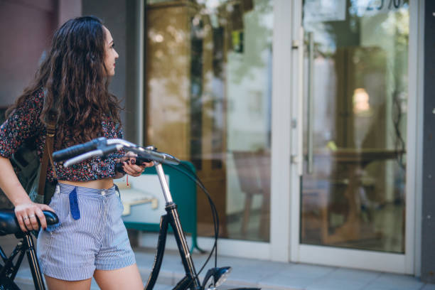 istock Young student girl with bike 826530278