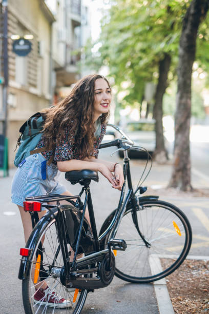 istock Young student girl with bike 826530672