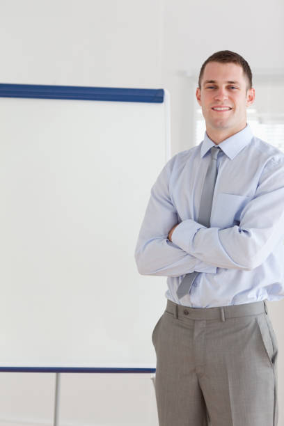 istock Smiling businessman giving a presentation 826541604