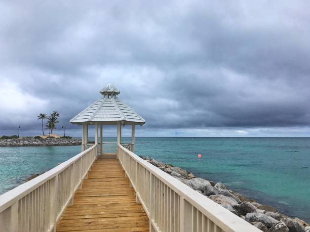 istock Beach scene with gazebo out on the ocean 826541792