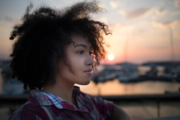 istock Young woman having fun at sunset 826555434