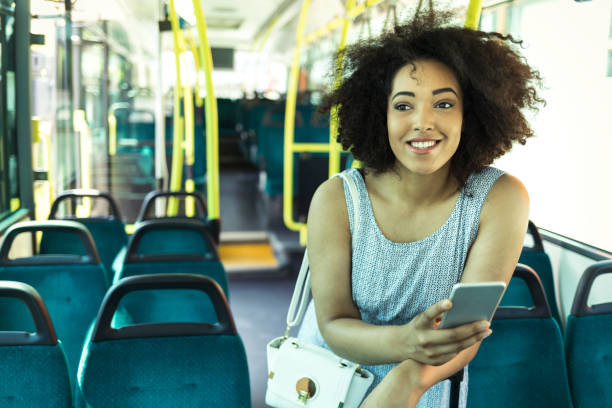 istock Woman using smart phone in bus 826555448