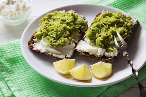 istock Avocado sandwiches with cottage cheese close up 826555938