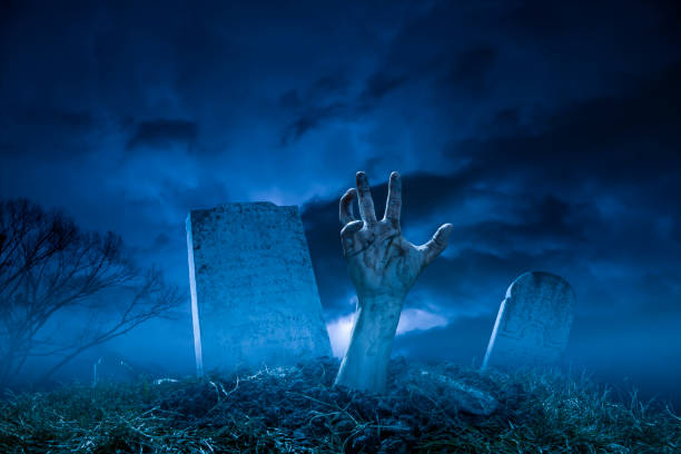 istock Spooky Halloween Graveyard Night Zombie Hand From The Grave 826556886