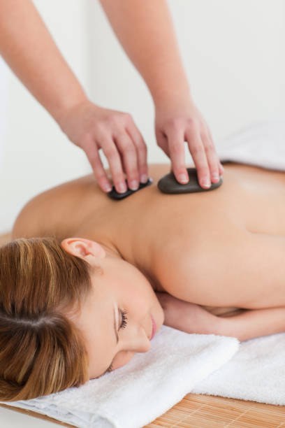 istock Therapist making a massage to an attractive blondhaired woman 826560742