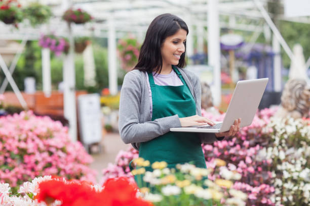 istock Woman doing stocktaking with laptop 826570994