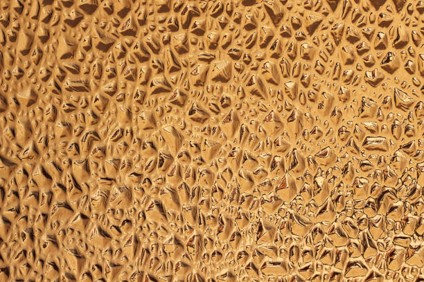 istock Decorative gold or yellow glass with an abstract embossed  pattern. 826575032