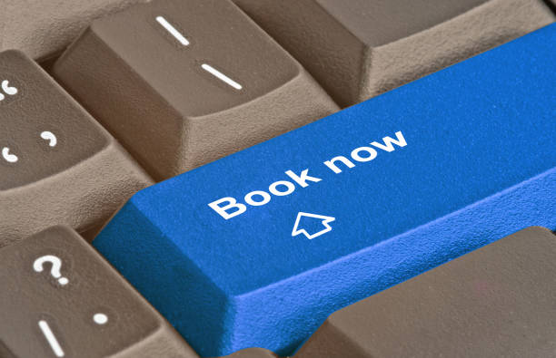 istock Keyboard with key for booking online 826581792