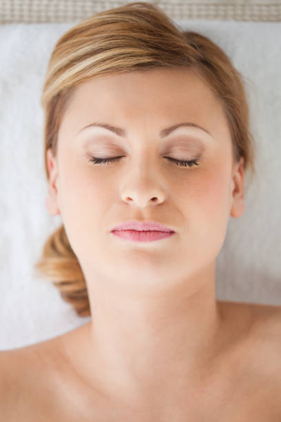 istock Young and pretty blondhaired woman lying down 826581804