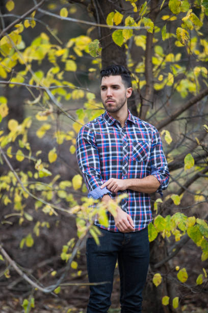 istock Handsome desolate man in the park. Autumn scenery 826581906
