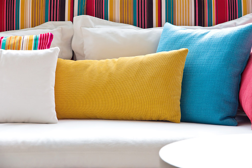 detail image of colorful cushion on sofa, living room, modern house, home decoration