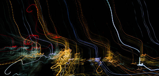 istock Abstract background of light bulbs at night in motion 826582434
