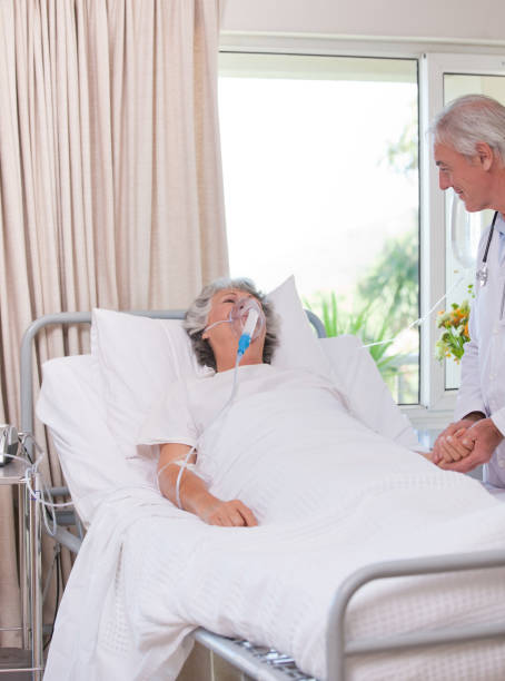 istock Senior doctor with his sick patient 826593342