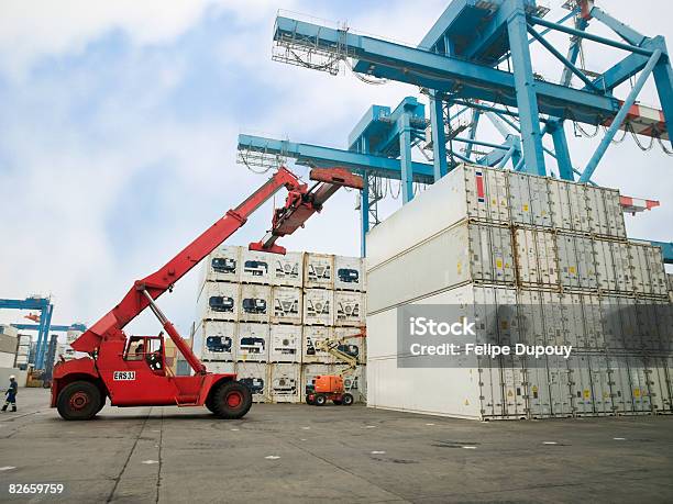 People Working In A Shipping Yard Stock Photo - Download Image Now - Forklift, Loading, Cargo Container