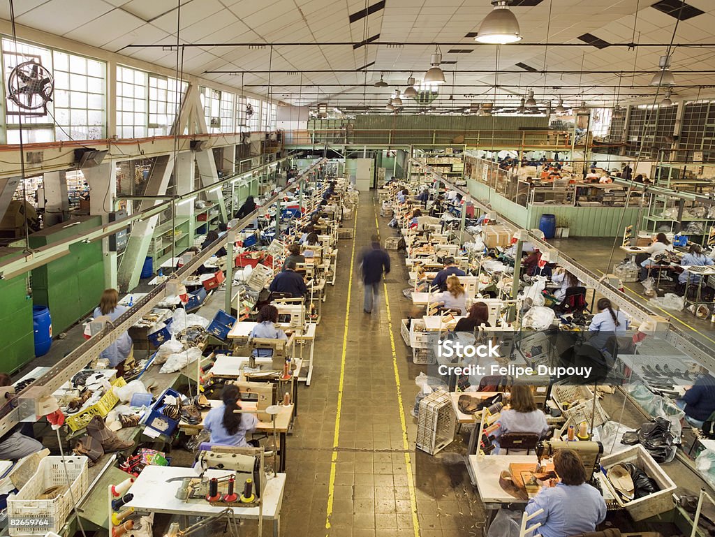 People working in a shoe factory  Factory Stock Photo