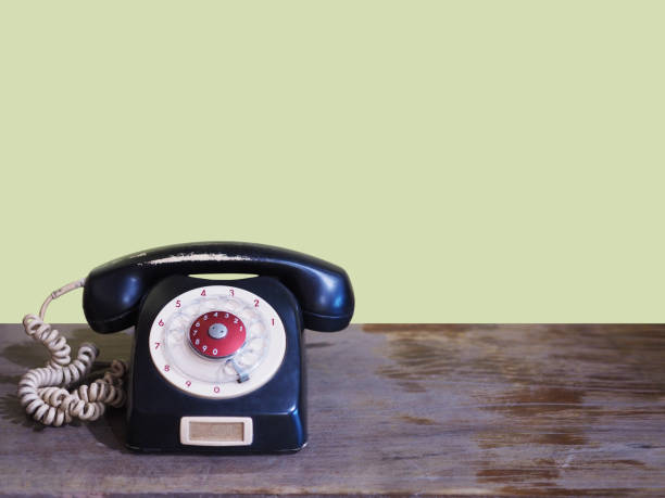 istock Black vintage telephone on wooden table 826597770