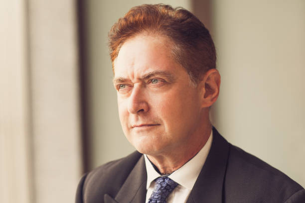 istock Pensive mature businessman contemplating_tone 826601394