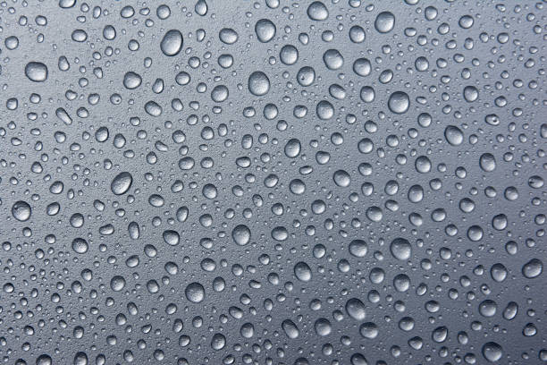 istock abstract water drops on a silver background.water drops on dark metal background 826601706