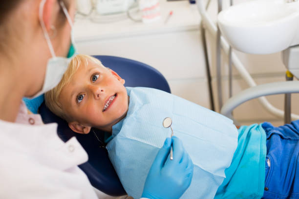 istock Professional in uniform is taking a view of a boy 826601872