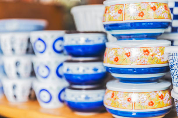 istock Carefully designed and painted bowls displayed for sale 826605444