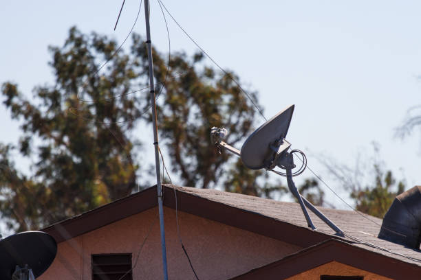 istock Satellite antenna on house roof 826606028