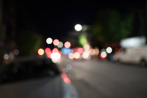 Blurred city lights at night in Astoria, New York.