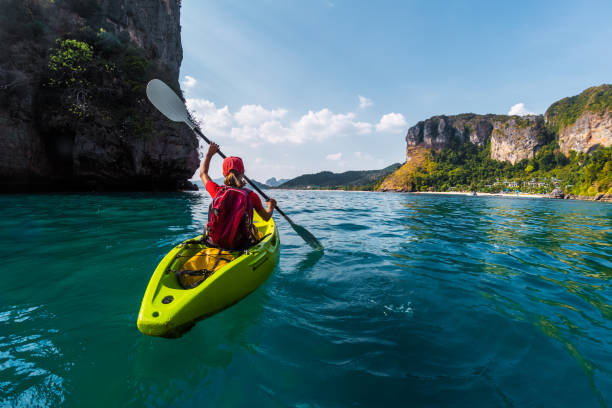 istock Woman paddles kayak 826609448