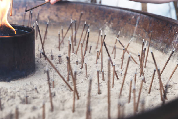istock Lit incense over an open bowl at a Japanese Shrine 826609590