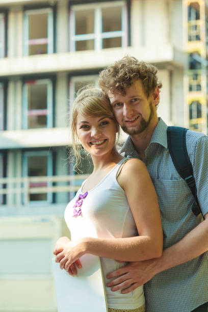 istock couple with blueprint project outdoor 826613116