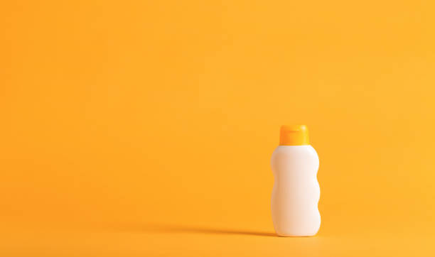 istock Sunscreeen on a yellow background 826613150