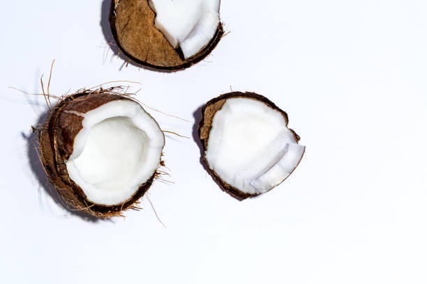 istock Fresh coconut on a yellow background 826613250